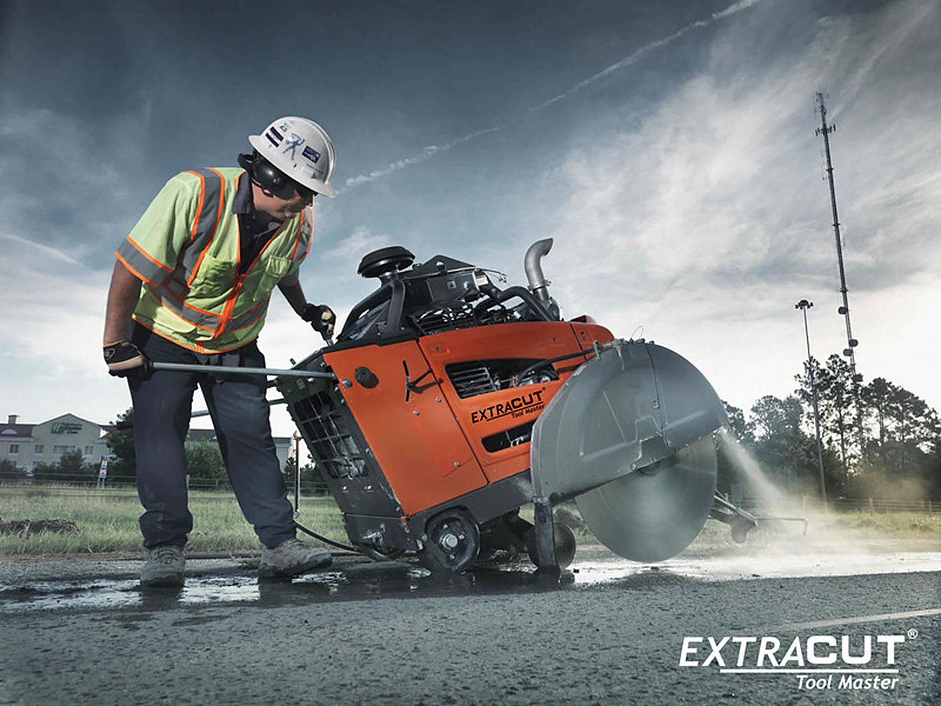 EXTRACUT diamond blade on a walk-behind floor saw cutting asphalt on a road job site